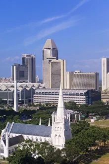 St. Andrews Anglican cathedral and modern city skyline, Singapore, South East Asia St. Andrews Anglican cathedral and modern city skyline, Singapore, South East Asia