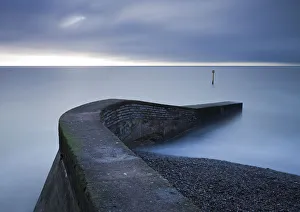 Winter Landscapes UK Prints: Stone jetty on the seafront at Sidmouth, Devon, England. Winter