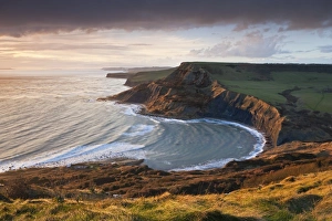 Storm light illuminates Chapmans Pool and Houns Tout cliff, viewed from St Aldhelms Head Storm light illuminates Chapmans Pool and Houns Tout cliff, viewed from St Aldhelms Head