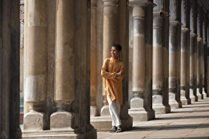 A student relaxes beside the pillars of the impressive Hugli Imambara building which was built in 1858 A student relaxes beside the pillars of the impressive Hugli Imambara building which was built in 1858