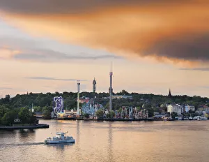 Sweden, Stockholm, Grona Lund Tivoli, passenger ferry in bay at dusk Sweden, Stockholm, Grona Lund Tivoli, passenger ferry in bay at dusk