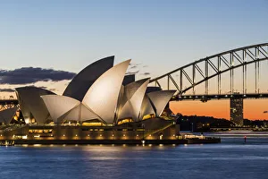Sydney at sunset. Opera house from Mrs Macquaries Chair. New South Wales, Australia Sydney at sunset. Opera house from Mrs Macquaries Chair. New South Wales, Australia