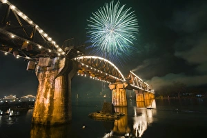 Thailand, Kanchanaburi, Kanchanaburi. Fireworks over Death Railway Bridge Thailand, Kanchanaburi, Kanchanaburi. Fireworks over Death Railway Bridge