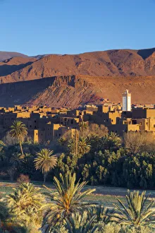 Tinerhir Kasbahs & Palmery illuminated at sunset, Tinghir, Morocco Tinerhir Kasbahs & Palmery illuminated at sunset, Tinghir, Morocco
