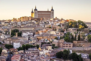 Toledo, Castille - La Mancha, Spain. View of the ancient city at sunset, from a vantage Toledo, Castille - La Mancha, Spain. View of the ancient city at sunset, from a vantage