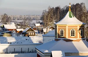 Tower of the Uspensky Cathedral with the old part of Tikhvin town in the background Tower of the Uspensky Cathedral with the old part of Tikhvin town in the background