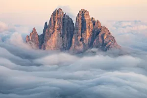 Tre Cime di Lavaredo emerging from the clouds, Sexten Dolomites, South Tyrol, Bolzano Tre Cime di Lavaredo emerging from the clouds, Sexten Dolomites, South Tyrol, Bolzano