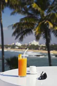 Tropical fruit juice on outdoor terrace table at Mount Lavinia Hotel, Mount Lavinia Tropical fruit juice on outdoor terrace table at Mount Lavinia Hotel, Mount Lavinia