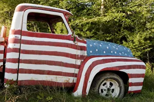 A truck painted with the US flag on a roadside in New Hampshire, USA A truck painted with the US flag on a roadside in New Hampshire, USA