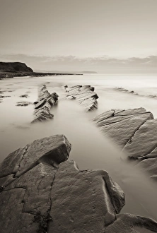 Twilight skies above rocky Kilve Beach on the Somerset Coast, England. Summer (July) Twilight skies above rocky Kilve Beach on the Somerset Coast, England. Summer (July)