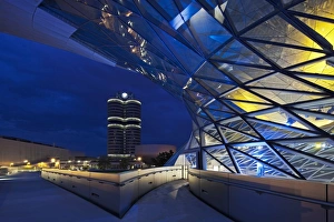 Twilight view of the pedestrian bridge link to the BMW Headquarters Office building Twilight view of the pedestrian bridge link to the BMW Headquarters Office building