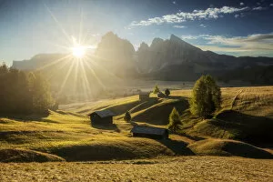 Alpe Di Siusi Collection: Some typical cabins in the meadows of the Alpe di Siusi (Seiser Alm) during an early autumn sunrise