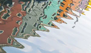 The typical colored houses of Burano reflecting in the small town canals The typical colored houses of Burano reflecting in the small town canals