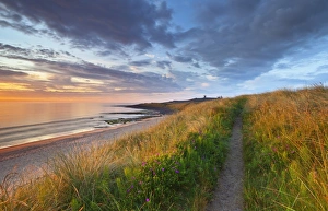 United Kingdom, UK, Northumberland, Sunrise at Dunstanburgh Castle United Kingdom, UK, Northumberland, Sunrise at Dunstanburgh Castle