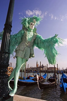 Venice Carnival People in Costumes and Masks on Canal with Gondolas Venice Carnival People in Costumes and Masks on Canal with Gondolas