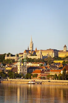 View along the River Danube towards Buda Hill & the Martyas Church illuminated View along the River Danube towards Buda Hill & the Martyas Church illuminated