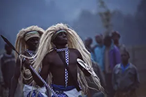Virunga, Rwanda. Traditional Intore dancers perform at the foot of the Volcanoes National Virunga, Rwanda. Traditional Intore dancers perform at the foot of the Volcanoes National