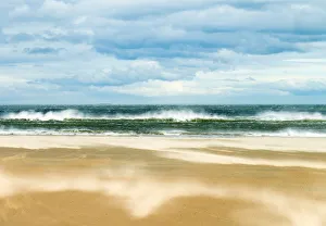 Windy day on the sandy beach between Bamburgh and Seahouses, Northumberland, UK Windy day on the sandy beach between Bamburgh and Seahouses, Northumberland, UK