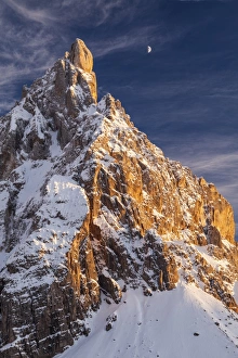 Winter sunset with moon over Cimon della Pala, Trentino Alto Adige, Italy Winter sunset with moon over Cimon della Pala, Trentino Alto Adige, Italy