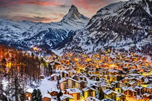 Winter twilight view over Zermatt and the iconic Matterhorn, Valais, Switzerland Winter twilight view over Zermatt and the iconic Matterhorn, Valais, Switzerland
