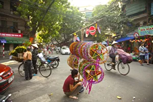 Woman selling decorations for the Mid Autumn moon festival, Old Quarter, Hanoi, Vietnam Woman selling decorations for the Mid Autumn moon festival, Old Quarter, Hanoi, Vietnam