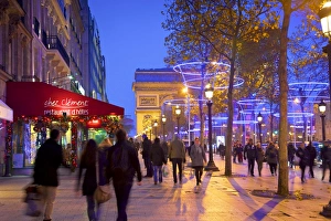 Xmas Decorations On Avenue des Champs-Elysees With Arc De Triomphe In Background Xmas Decorations On Avenue des Champs-Elysees With Arc De Triomphe In Background