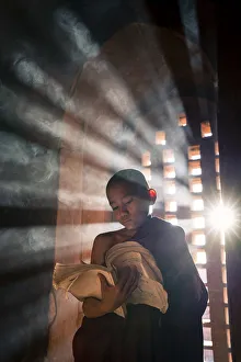 Myanmar Prints: A Young Monk Reads by a Temple Window, Bagan Print