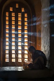 Myanmar Prints: A Young Monk Studies by a Window in Bagan Temple Print