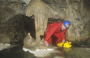 A caver in Kingsdale master cave, Yorkshire Dales, UK A caver in Kingsdale master cave, Yorkshire Dales, UK