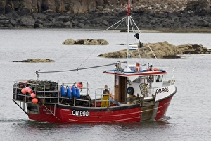 Creel boat. Eilean Ban shooting creels to catch lobster, crab etc. Hebrides, Scotland Creel boat. Eilean Ban shooting creels to catch lobster, crab etc. Hebrides, Scotland