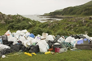 Piles of rubbish collected from beach beyond, Torloisk beach, Isle of Mull, Scotland (RR) Piles of rubbish collected from beach beyond, Torloisk beach, Isle of Mull, Scotland (RR)