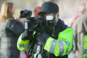 Police photographer photographing protestors at a climate change rally in London December 2008 Police photographer photographing protestors at a climate change rally in London December 2008