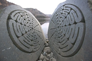 A split rock sculpture on Derwent Water Keswick UK A split rock sculpture on Derwent Water Keswick UK