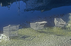 Supermarket trolleys thrown into Whitehaven harbour by vandals, Cumbria, UK Supermarket trolleys thrown into Whitehaven harbour by vandals, Cumbria, UK