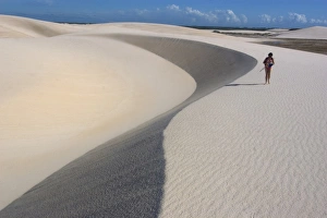 Tourist walks on the sand dunes of Lencois Maranhenses National Park, Santo Amaro Tourist walks on the sand dunes of Lencois Maranhenses National Park, Santo Amaro