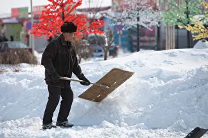 Workers in Heihe on the Chinese Russian border shovel heavy snow from the worst snowstorm to hit northern China in Workers in Heihe on the Chinese Russian border shovel heavy snow from the worst snowstorm to hit northern China in