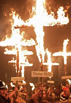 Burning crosses at the annual bonfire night parade held in Lewes, East Sussex Burning crosses at the annual bonfire night parade held in Lewes, East Sussex