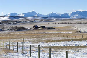 Canada, Alberta, Rockies Farmland south of Magrath and the Rocky Mountains covered in Canada, Alberta, Rockies Farmland south of Magrath and the Rocky Mountains covered in