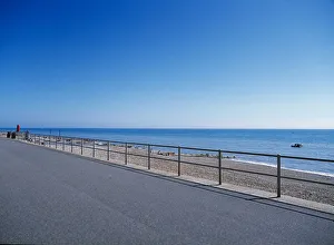 ENGLAND East Sussex Bexhill on Sea View from path across railings towards shingle beach ENGLAND East Sussex Bexhill on Sea View from path across railings towards shingle beach