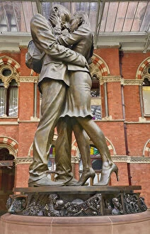 Transport Collection: England, London, St Pancras railway station on Euston Road, The Meeting Place statue by Paul Day