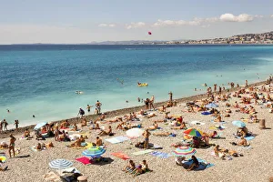 France, Nice, Baie Des Anges and tourists sunbathing on beach France, Nice, Baie Des Anges and tourists sunbathing on beach