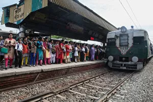 Transport Collection: India, West Bengal, Kolkata, A train arrives at the platform at Garia Railway Station