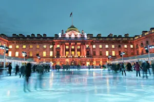 Skaters, early evening on the seasonally assembled ice rink at Somerset House, London Skaters, early evening on the seasonally assembled ice rink at Somerset House, London