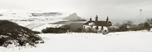 The snow covered chalk cliffs of the Seven Sisters viewed from across from the coastguard The snow covered chalk cliffs of the Seven Sisters viewed from across from the coastguard