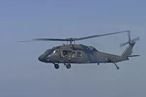 Tsunami. A helicopter in flight with rescue workers are flown from Phuket to look for missing victims in Phangng north Tsunami. A helicopter in flight with rescue workers are flown from Phuket to look for missing victims in Phangng north