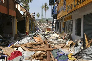 Tsunami. Phi Phi on the 11th day after the tsunami hit Shattered shops and restaurants with 2 feet of debris covering Tsunami. Phi Phi on the 11th day after the tsunami hit Shattered shops and restaurants with 2 feet of debris covering
