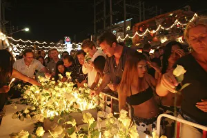 Tsunami. Thais and foreigners pay respect and have a vigil for the dead with candels Tsunami. Thais and foreigners pay respect and have a vigil for the dead with candels