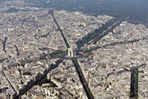 An aerial view shows the Arc de Triomphe and rooftops of residential buildings in An aerial view shows the Arc de Triomphe and rooftops of residential buildings in
