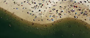 An aerial view shows people cooling off at a beach on the shores of the Silbersee lake An aerial view shows people cooling off at a beach on the shores of the Silbersee lake