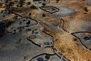 An aerial view shows the remains of burnt homes from what residents said was the latest An aerial view shows the remains of burnt homes from what residents said was the latest